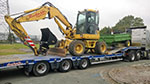 Komatsu PW98MR on Flatbed